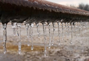Icicles hanging from a pipe